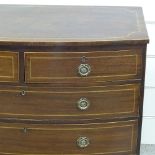 An early 19th century mahogany bow-front chest of 3 long and 2 short drawers, with inlaid banding,