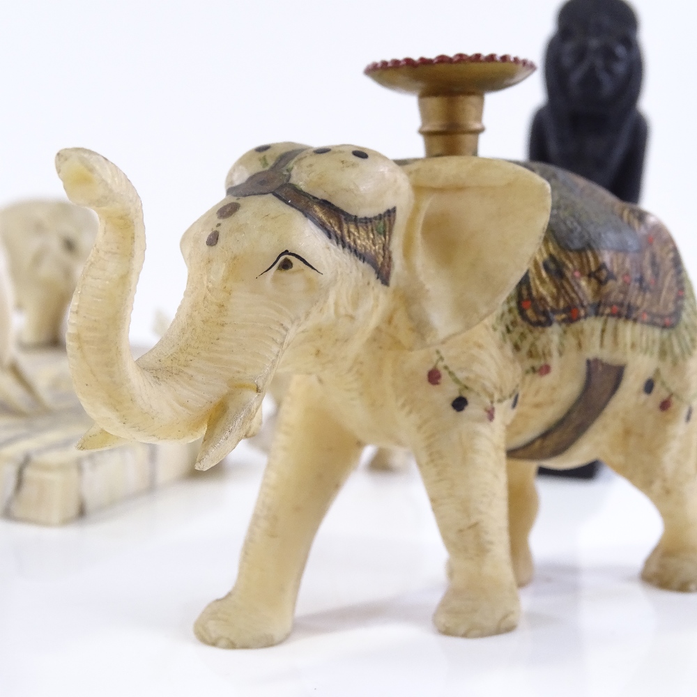 A small group of Indian carved ivory elephant figures, circa 1900, including one with gilded - Image 2 of 3