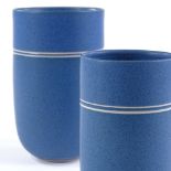 Louise Darby (British - born 1957), 2 blue glaze Studio pottery cylinder vessels, with wax-resist