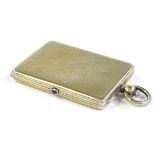 A lady's silver-gilt necessaire with cabochon sapphire thumb piece, unmarked, length 5.5cm, 2.1oz