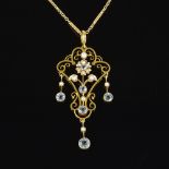 A 9ct gold aquamarine and pearl pendant necklace, with pierced floral openwork body and 3 drops,