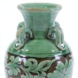 A Chinese green glaze porcelain vase, with neck ring handles and floral decoration, height 26cm