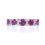 A 14ct white gold ruby and diamond half-hoop ring, total ruby content approx 1.11ct, total diamond