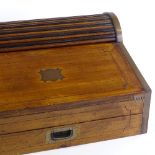 A 19th century military campaign camphorwood travelling writing slope, with roll top, width 52cm