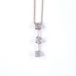A 14ct gold graduated 3-stone diamond line pendant, on 14ct chain, total diamond content approx 0.