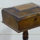 A 19th century rosewood teapoy, with beaded mouldings, turned century column and platform base,