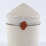 Inger Rokkjaer (Danish - 1934 - 2008), a white glaze raku jar and cover, impressed maker's mark