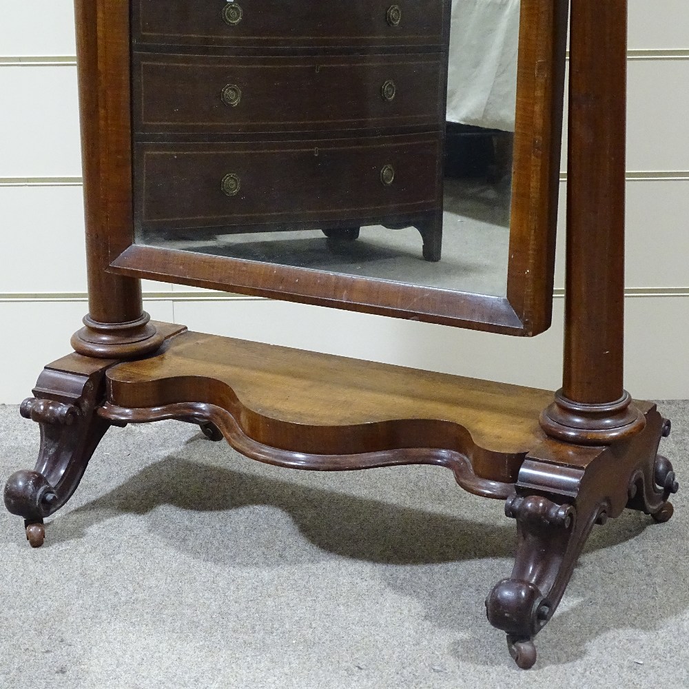 A Victorian mahogany arch-top cheval mirror, with turned tapered columns and carved base, mirror - Image 2 of 4