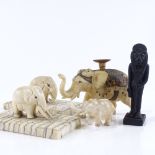 A small group of Indian carved ivory elephant figures, circa 1900, including one with gilded