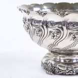 A Tiffany & Co. sterling silver circular punch bowl, with relief embossed leaf and foliate body,
