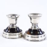 A pair of tortoiseshell and silver-mounted squat candlesticks, possibly by Corke & Apthorp,