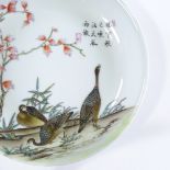 A Chinese Republic white glazed porcelain dish, with hand painted geese and blossom trees, text