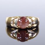 A 9ct gold 3-stone cat's eye scapolite and diamond ring, with pierced shoulders, setting height 6.