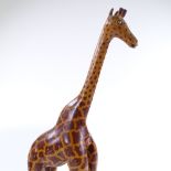 A carved and painted wood giraffe, circa 1930s, height 55cm