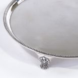 A George III circular silver card tray / salver, with bead edge, by John Crouch I and Thomas Hannam,
