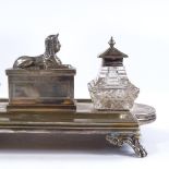 A Victorian electroplate Egyptian revival desk stand, surmounted by a Sphinx with original cut-glass