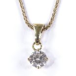 An 18ct gold 0.5ct solitaire diamond pendant necklace, on a 9ct chain, pendant height 12.7mm,