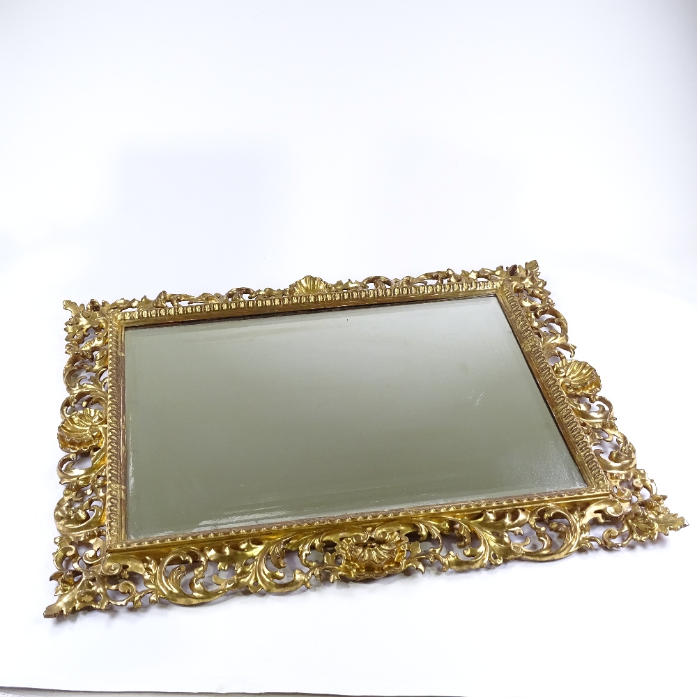 A 19th century carved giltwood Florentine wall mirror, with acanthus scroll frame, overall