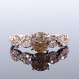 A 14ct rose gold 1.01ct solitaire diamond ring, with overlapping pierced diamond set shoulders,