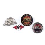 A German Stalhelm badge, Hitler Youth enamel badge with RZM marks, an RDH badge, and a League of