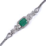 An Art Deco 18ct white gold emerald and diamond bracelet, with mesh strap, emerald measures: