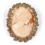 A relief carved cameo shell panel brooch/pendant, depicting female portrait, in 9ct pierced