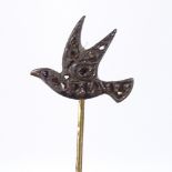 A figural diamond set bird stickpin, pave set with rose-cut diamonds and cabochon ruby eye, length