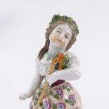 A German porcelain figure of a country girl, height 19cm