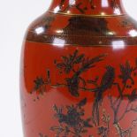 A Chinese red ground porcelain vase with painted and gilded exotic birds, seal mark under base,
