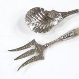 An unmarked Georgian silver tea leaf caddy spoon, length 8cm, together with a silver and mother-of-