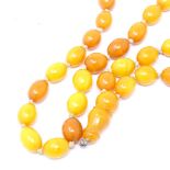 A string of polished butterscotch amber beads, each approx 13.2mm, 42.1g