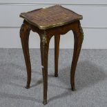 A French kingwood occasional table, with parquetry top and ormolu mounts, 10" across, height 21"