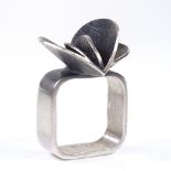 A Borge Nielsen Danish sterling silver stylised ring, with petal decoration and square shank,
