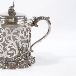 A Victorian silver and cut-glass mustard pot, of pierced foliate form, with cast knop and acanthus