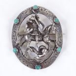 A Vintage silver and turquoise George and the Dragon brooch, with pierced and foliate engraved