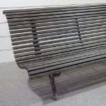 A good quality cast-iron framed garden bench with oak slatted seat, length 5'7"