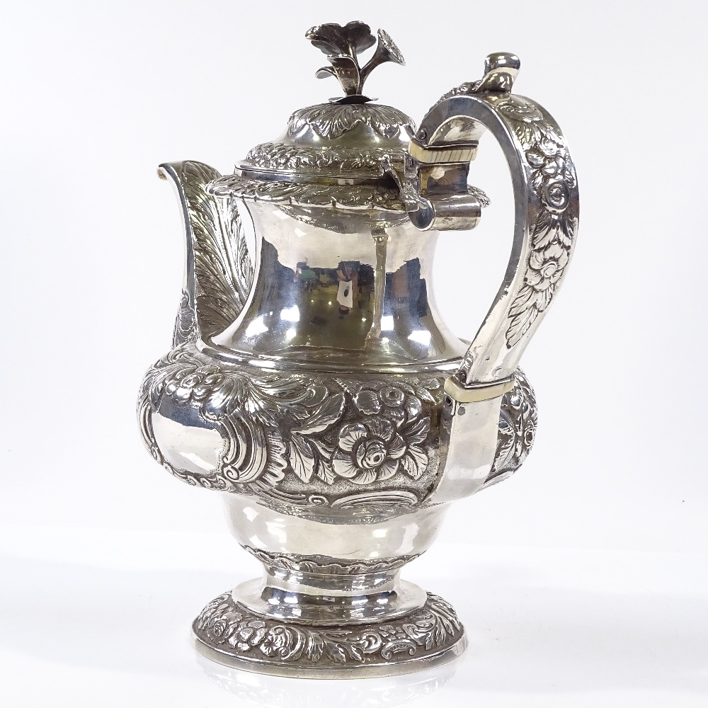 A George IV Irish silver coffee pot, with relief embossed floral and foliate decoration, with - Image 3 of 4