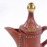 An Egyptian gilded terracotta coffee pot, height 27cm