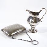 A silver-mounted evening purse by Boots Pure Drug Company, hallmarks Birmingham 1918, length 10cm,