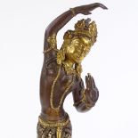 An Indian patinated and gilded bronze dancing figure, height 20cm