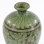 A Chinese green glazed ovoid vase, with incised leaf decoration, height 26cm