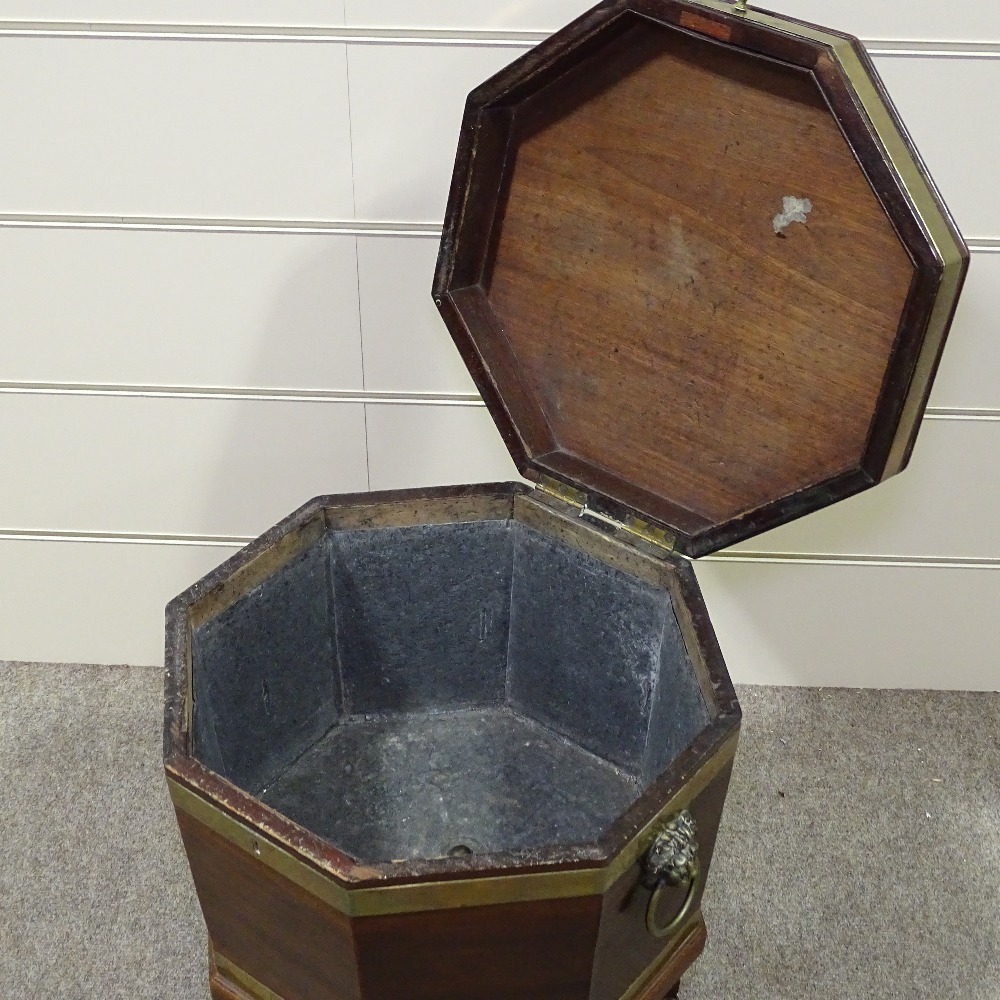 A George III brass-bound mahogany wine cooler of octagonal form, on tapered legs, with brass lion - Image 7 of 8