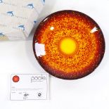 A Poole Pottery dish "The Sun" no. 287/1000, boxed with certificate, 25cm diameter