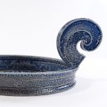 Walter Keeler (British born 1942), blue salt glaze platter with large swirling scroll handles,