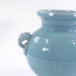 A Chinese turquoise glaze porcelain 2-handled vase, with embossed frieze, height 27cm, rim