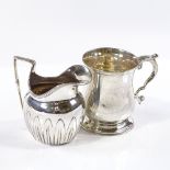 A silver christening mug of baluster form, hallmarks Chester 1916, height 8cm, together with a small