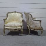 A pair of French carved and painted wood framed fauteuille armchairs with cream silk upholstery