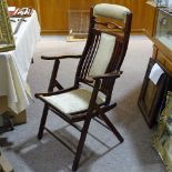 A Victorian mahogany folding elbow chair