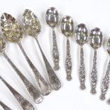 A set of 6 Georgian silver berry teaspoons, with engraved handles and relief embossed gilt bowls,