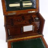 A Victorian oak stationery box with fitted interior and inkwell, width 37cm